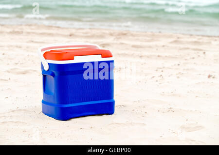 Cooler box in Australian Flag colors standing on sand at the beach Stock Photo
