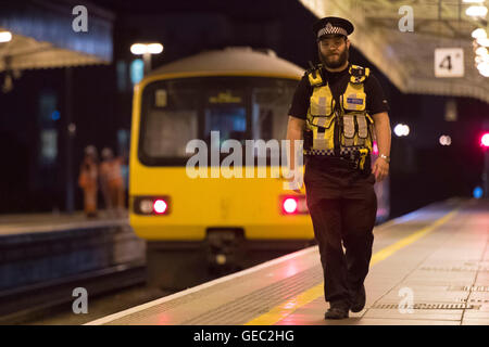 British Transport Police (BTP) officer on patrol at Cardiff Central train station. Stock Photo
