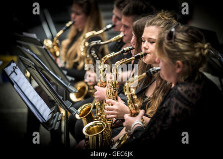 Students from Newquay Tretherras jazz band performing at Trebah Gardens amphitheatre in Cornwall.