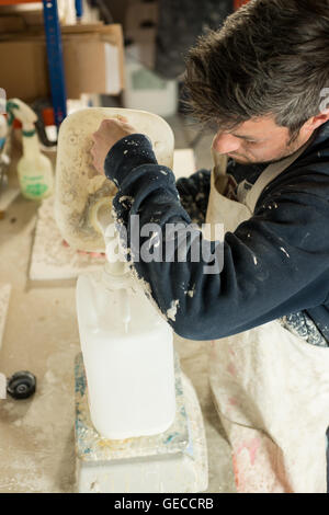 Man about to pour some plaster Stock Photo - Alamy