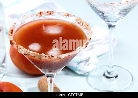 Bloody Mary cocktails on a blue wooden table Stock Photo