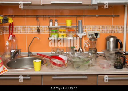 A pile of dirty dishes in the kitchen Stock Photo