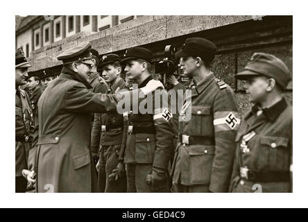 HITLER LAST DAYS 1945 One of the last public appearances and images of Adolf Hitler meeting and awarding medals to his fiercely loyal but misled Hitler Youth members April 1945 WW2 World War II Stock Photo