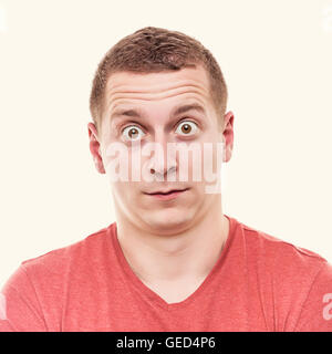 Man is very surprised. On white background. Toned photo. Stock Photo