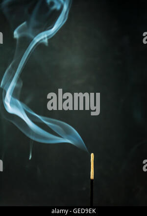incense sticks smoke on black background Stock Photo