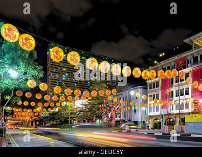 Singapore, Singapore - February 29, 2016: Singapore New Bridge Road in Chinatown decorated with illuminated red lanterns due to the celebration of the Chinese New Year. At night Stock Photo