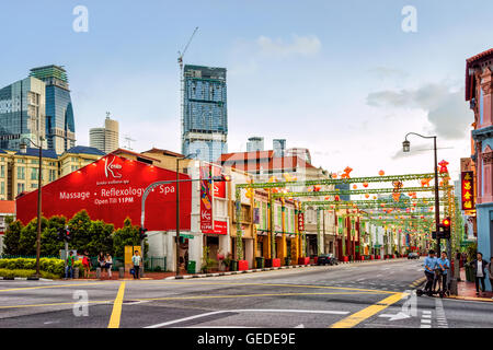 Singapore, Singapore - February 29, 2016: Singapore South Bridge Road of Chinatown decorated with monkeys and red lanterns due to the celebration of the Chinese New Year. Stock Photo