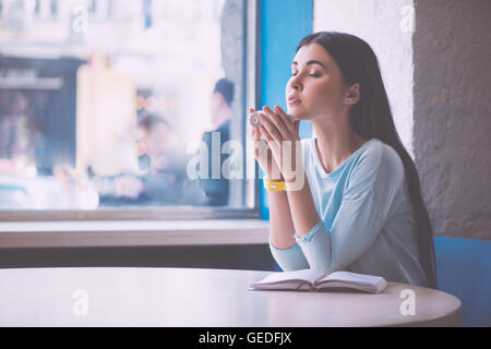 Young confident woman drinking coffee Stock Photo