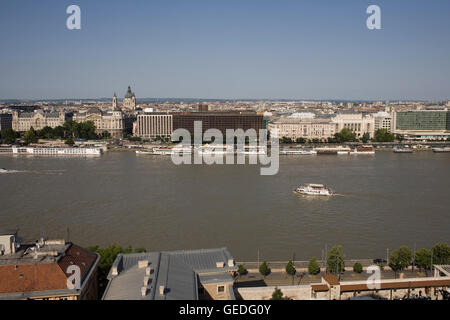 River Danube on warm summer afternoon seen from Buda side across to Intercontinental Hotel Stock Photo