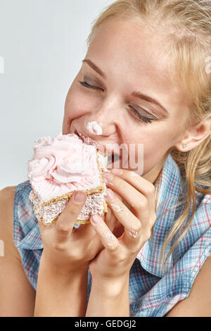 happy fun girl eating sweet dessert Stock Photo
