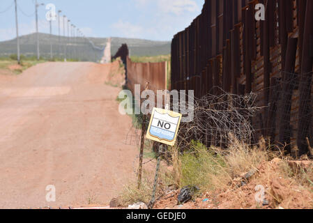 The border between Naco, Arizona, USA and Naco, Sonora, Mexico is indicated by a metal wall, as seen from Arizona. Stock Photo