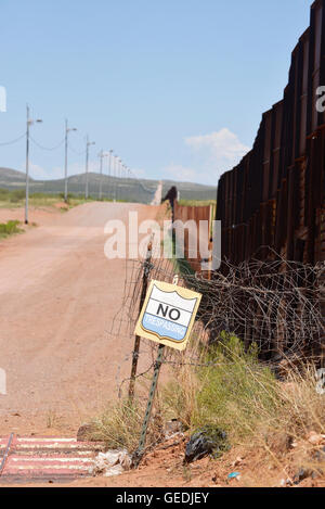 The border between Naco, Arizona, USA and Naco, Sonora, Mexico is indicated by a metal wall, as seen from Arizona. Stock Photo