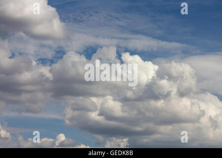 White Fluffy Clouds Fly In Sky. White Cloud With Many Other Clouds 