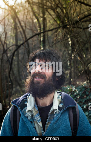 Portrait of Bearded Man Standing in Woods Stock Photo