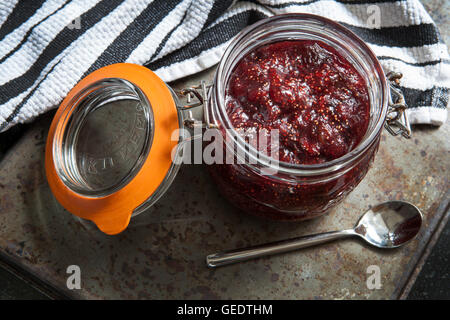Fig Jam in Glass Jar with Spoon, High Angle View Stock Photo