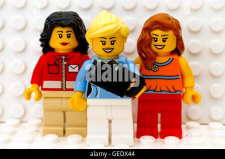 Tambov, Russian Federation - July 24, 2016 Three Lego girl minifigures make selfie. White background. Studio shot. Stock Photo