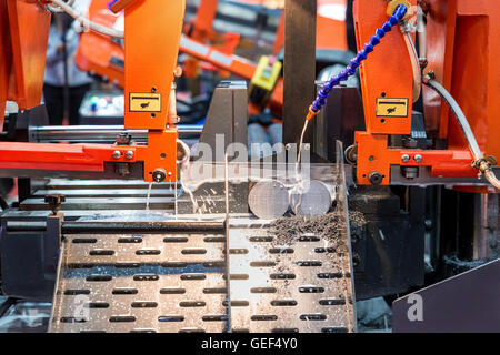 Steel band saw machine working in industry factory. Stock Photo