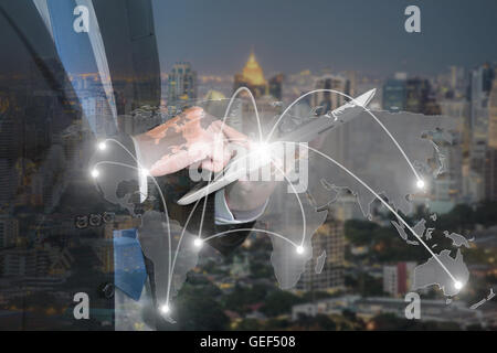 Businessman press digital tablet to show global network partnership connection use for logistic,import,export background. Stock Photo