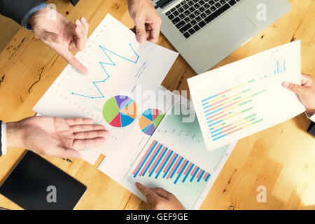 business partners in suit discussing documents and ideas at meeting Business concept, soft focus, vintage tone Stock Photo