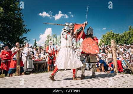 Dudutki, Belarus - July19, 2014: Historical restoration of knightly fights on festival of medieval culture. Knights In Fight Wit Stock Photo