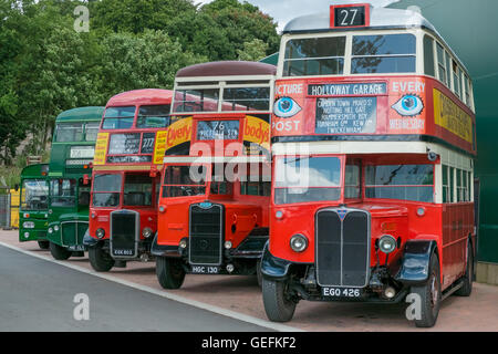 WEYBRIDGE, SURREY, UK - AUGUST 18: A line of vintage red and green vintage London buses. Stock Photo