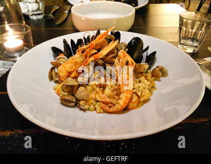seafood risotto, king prawns, clams, fresh, italian cuisine, italy, dining, fine dining, restaurant, mood, date, dishes, present Stock Photo