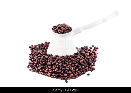 White porcelane turk and coffee beans isolated on white Stock Photo