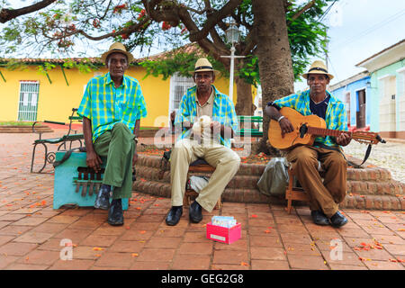 Cuban band of street musicians play in a public square in Trinidad, Cuba Stock Photo