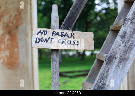 No Pasar - Don't Cross handwritten wooden warning sign in front of steep steps, Cuba Stock Photo