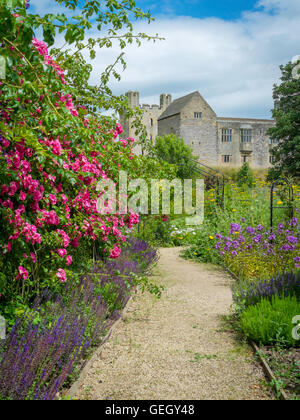 Helmsley Castle overlooking the Helmsley Walled Garden with a show of summer flowers Stock Photo