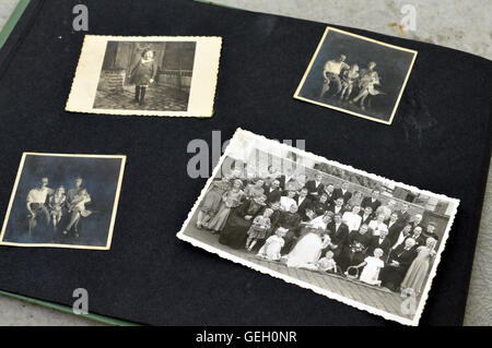 Photo album with old black and white family photos. Stock Photo