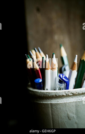 A pot of sharpened coloured lead pencils. Stock Photo