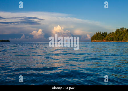 Panoramic View Bungalow in Indonesia Village Tropical Beach in Bali Island Sunset. Summer Season Caribbean ocean. Horizontal Picture. Stock Photo