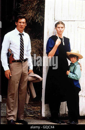 Harrison Ford, Kelly McGillis, Lukas Haas   Polizist Book (Harrison Ford,l) hat herausgefunden, dass der Moerder ein Kollege von ihm ist und flieht mit Rachel (Kelly McGillis) und Samuel (Lukas Haas,r) in deren Amish-Siedlung. *** Local Caption *** 1985, Stock Photo