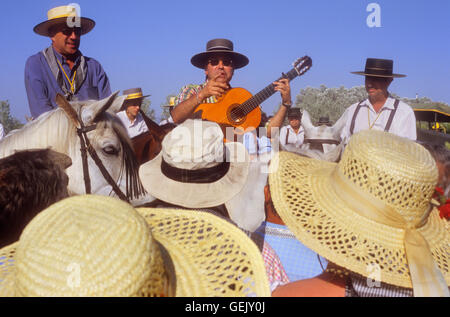 pilgrims singing near Doñana Palace,Romeria del Rocio, pilgrims on their way through the Doñana National Park,  pilgrimage of Sa Stock Photo
