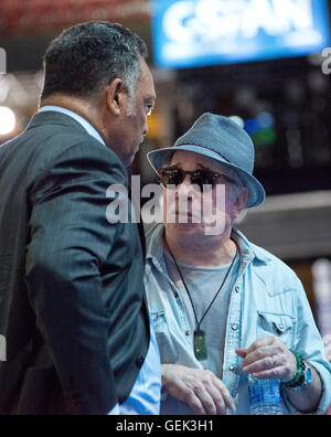 Philadelphia, USA. 24th July, 2016. Singer and songwriter Paul Simon and the Reverend Jesse Jackson, Sr. prior to the start of the 2016 Democratic National Convention held at the Wells Fargo Center in Philadelphia, Pennsylvania on Sunday, July 24, 2016. Credit: Ron Sachs/CNP (RESTRICTION: NO New York or New Jersey Newspapers or newspapers within a 75 mile radius of New York City) © dpa/Alamy Live News Stock Photo