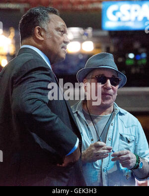 Philadelphia, USA. 24th July, 2016. Singer and songwriter Paul Simon and the Reverend Jesse Jackson, Sr. prior to the start of the 2016 Democratic National Convention held at the Wells Fargo Center in Philadelphia, Pennsylvania on Sunday, July 24, 2016. Credit: Ron Sachs/CNP (RESTRICTION: NO New York or New Jersey Newspapers or newspapers within a 75 mile radius of New York City) © dpa/Alamy Live News Stock Photo