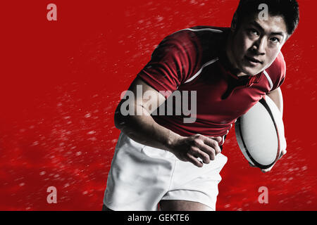 Portrait of Japanese rugby player with ball Stock Photo