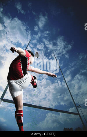 Portrait of Japanese rugby player kicking Stock Photo