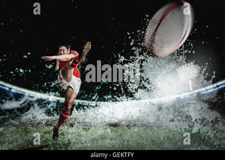 Portrait of Japanese rugby player kicking Stock Photo