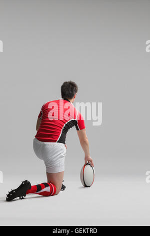 Portrait of Japanese rugby player with ball Stock Photo