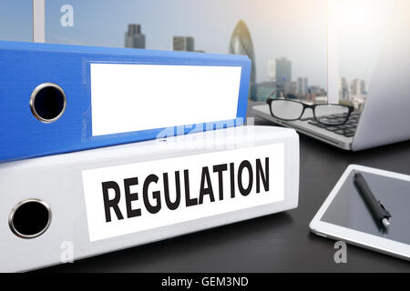 REGULATION Office folder on Desktop on table with Office Supplies. Stock Photo