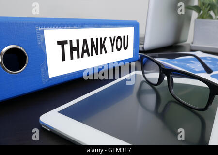 THANK YOU Office folder on Desktop on table with Office Supplies. ipad Stock Photo