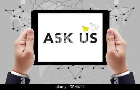 Ask us concept on the tablet pc screen by businessman hands, top view Stock Photo