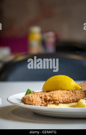 Gourmet fish and chips meal served with side salad Stock Photo