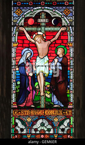 The Crucifixion of Jesus, with Mary and John, Old Hunstanton, detail of stained glass window by Frederick Preedy, 1867, commemor Stock Photo