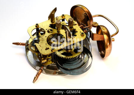 mechanism of old vintage alarm clock on a white background Stock Photo