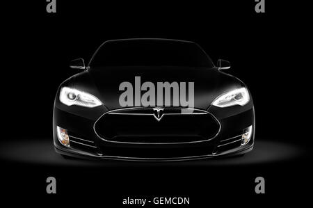 License and prints at MaximImages.com - Black 2017 Tesla Model S luxury electric car front view isolated on dark black background with clipping path Stock Photo