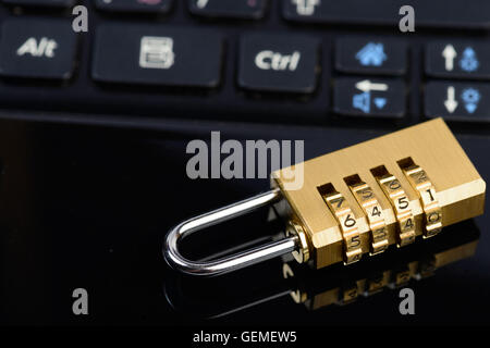 Data security concept with padlock on laptop computer keyboard Stock Photo