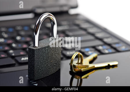 Data security concept with padlock on laptop computer keyboard Stock Photo